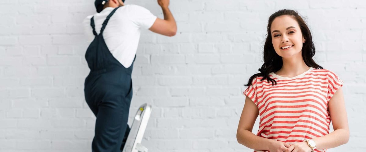 selective-focus-of-smiling-woman-looking-at-camera-2022-11-11-05-50-29-utc